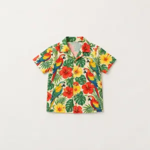 Little Parrot Kids Camp Shirt with all-over print of parrots perched among hibiscus flowers in red, green and yellow