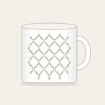Sage Lattice Diamonds with Tiny Blossoms Mug in white: A lattice of diamonds in sage and cream is dotted with tiny blossoms.