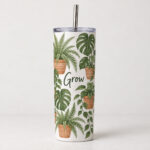 White straight-body tumbler printed with terracotta pots and fern leaves, with steel straw