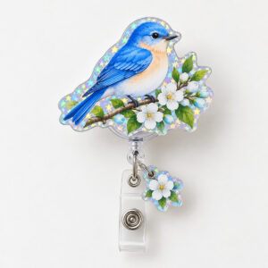 Bluebird Branch Hologram Badge Reel with a bluebird on a blossoming branch in blue, white and green