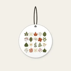 Pressed Leaf Specimen Grid Ceramic Ornament in white: A grid of pressed leaves and blossoms in green, rust and cream with tiny index lines.