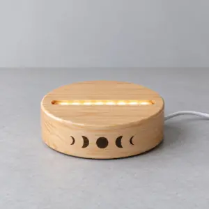 Moon Phase Night Light Base with a round base with a ring of printed moon phases along the front edge, single tone