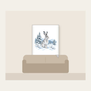 Hare in a Snowy Field with Pines Fleece Blanket in white: A hare pauses in a snowy field among pines in white, grey and ice blue.
