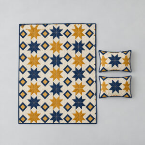 Starry Patchwork Quilt Set with a patchwork of stars and diamonds in navy, mustard and cream