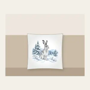 Hare in a Snowy Field with Pines Pillow in white: A hare pauses in a snowy field among pines in white, grey and ice blue.