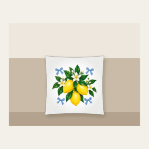 Lemons with Gingham Corners Pillow in white: Bright yellow lemons and deep green leaves on a clean white ground, tucked with small blue gingham accents.