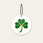 Gold-Edged Clover Leaf Ceramic Ornament in white: A flat clover leaf in green and gold sits inside a thin border line.