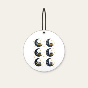 Crescent Moon with a Stack of Books Ceramic Ornament in white: A crescent moon holds a small stack of books among tiny stars in navy and gold.