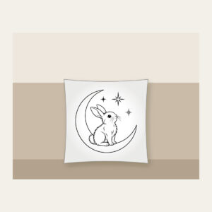 Line-Art Rabbit on a Crescent Moon Pillow in white: A white line-art rabbit sitting on a crescent moon with three stars.