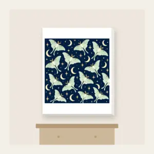 Luna Moths and Crescent Moons on Navy Canvas Print in white: Pale luna moths and crescent moons glow on deep navy among tiny star dots.