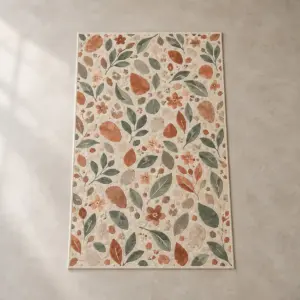 Terrazzo Garden Rug with all-over terrazzo of leaves, pebbles and blossoms in terracotta, sage and cream