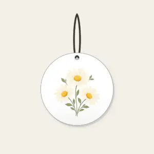 Three Daisies in Butter Yellow Ceramic Ornament in white: Three daisies with tiny leaves in cream, butter yellow and sage.