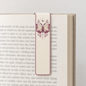 Book Moth Magnet Bookmark with a small moth whose open wings form the pages of a book in plum and cream near the top of the tall narrow bookmark with a thin plum border