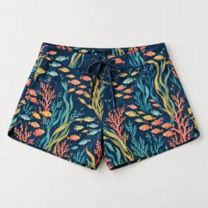 Tropical Fish Board Shorts with a school of small tropical fish and seaweed in coral, yellow and teal on navy
