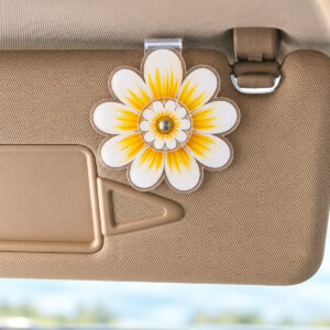 Acrylic daisy car visor clip with a small central spinning daisy disc.