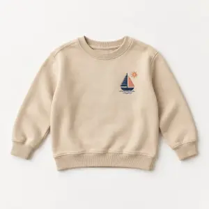 Sand Little Sailboat Youth Sweatshirt with embroidery of a sailboat with two sails and a small sun on the left chest in navy, coral and cream