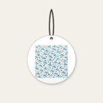Tiny Waves and Pebbles Repeat Ceramic Ornament in white: A small-scale repeat of waves and pebbles in navy, teal and sand.