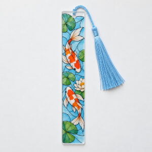 Koi Pond Suncatcher Bookmark with flat orange-and-white koi and green lily pads with dark stained-glass-style ink contours, light-blue tassel