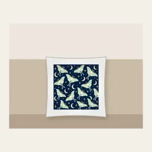 Luna Moths and Crescent Moons on Navy Pillow in white: Pale luna moths and crescent moons glow on deep navy among tiny star dots.