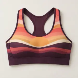 Sunrise Stripes Racerback Sports Bra with a sunrise of stacked stripes in coral, gold and cream over a deep plum base