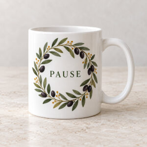 Olive Grove Ceramic Mug with flat printed olive branch wreath with dark olive fruits, restrained olive green leaves and small ochre dots, exact central text PAUSE in simple deep green serif letters