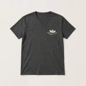 Dark Heather Paper Boat V-Neck Tee with compact front chest panel print of a paper boat on a wave line in cream and coral