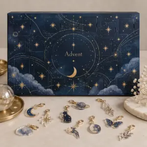 Midnight blue advent calendar box with gold constellations and acrylic charms
