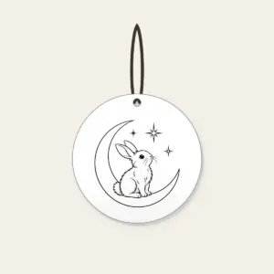 Line-Art Rabbit on a Crescent Moon Ceramic Ornament in white: A white line-art rabbit sitting on a crescent moon with three stars.