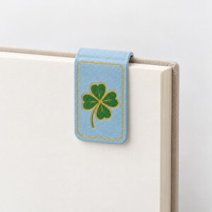 Clover Study Leather Bookmark with a flat printed clover leaf in green and gold with a thin border line