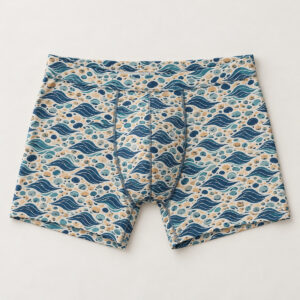 Blue Tide Men's All-Over Boxer Briefs with all-over repeat of small waves and pebbles in navy, teal and sand, scaled small for a close-fitting garment