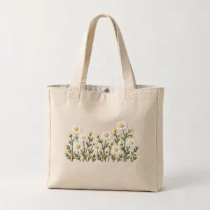 Embroidered Daisy Chain Tote with a small white and yellow daisy chain embroidered above the lower front hem without crossing seams