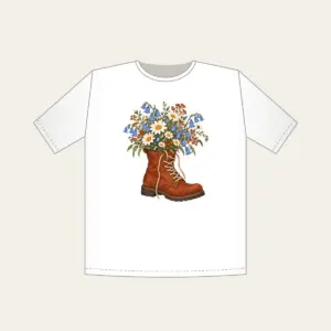 Lace-Up Boot Overflowing with Daisies T-Shirt in white: A lace-up boot spilling daisies and bluebells in cream, sky blue and rust.