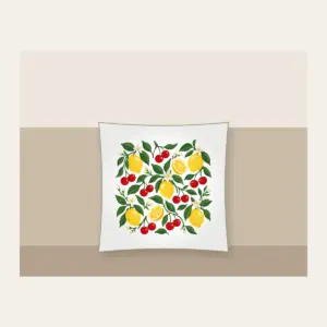 Cherry and Lemon Orchard Pattern Pillow in white: Cherries, lemons and leaves in red, yellow and green scattered across a cream field.