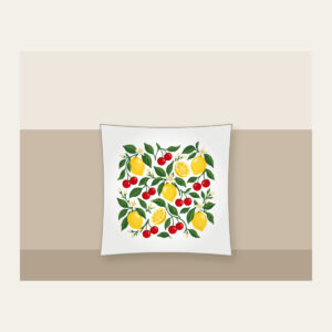 Cherry and Lemon Orchard Pattern Pillow in white: Cherries, lemons and leaves in red, yellow and green scattered across a cream field.