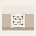 Pressed Leaf Specimen Grid Pillow in white: A grid of pressed leaves and blossoms in green, rust and cream with tiny index lines.
