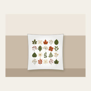 Pressed Leaf Specimen Grid Pillow in white: A grid of pressed leaves and blossoms in green, rust and cream with tiny index lines.