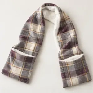 A plaid Velboa scarf with two open hand pockets and sherpa lining.