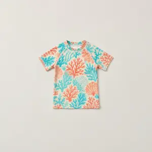 Youth Coral Reef Short-Sleeve Rash Guard with all-over coral reef shapes in coral, aqua and cream