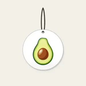 Halved Avocado Study Ceramic Ornament in white: An avocado cut open in leaf green, with a warm brown pit and a pale cream highlight.