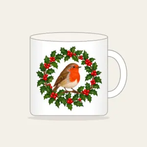 Robin in a Holly Wreath Mug in white: A robin perches in a holly wreath in red, brown and green.
