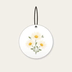 Three Daisies in Butter Yellow Ceramic Ornament in white: Three daisies with tiny leaves in cream, butter yellow and sage.
