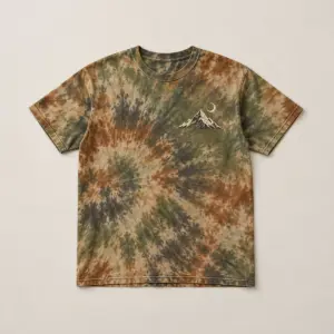 Earth Tie-Dye Quiet Peak Tee with compact front chest panel print of a single peak and crescent moon in cream and charcoal, designed to sit on an earth tie-dye base