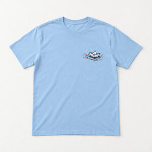 Paper Boat Harbor Tee with small chest print of a folded paper boat on ink-line waves in navy and coral
