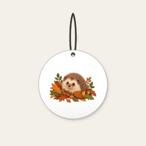 Hedgehog Among Fallen Leaves Ceramic Ornament in white: A small hedgehog wanders among fallen leaves in brown, rust and green.