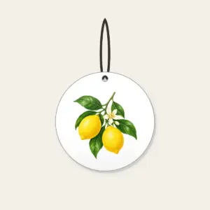 Lemon Branch in Blossom Ceramic Ornament in white: A single lemon branch carries two lemons, glossy leaves and a small blossom in lemon yellow, leaf green and cream.