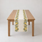 Olive Branch Border Table Cloth with an olive and lemon branch border along both long edges in green, gold and cream