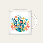 Tropical Fish School and Seaweed on Navy Mug in white: A school of small tropical fish and seaweed in coral, yellow and teal swims on navy.