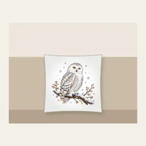 Snowy Owl in Snowfall Pillow in white: A snowy owl on a branch in white, slate and amber with falling snowflakes.