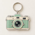 Vintage Camera Two-Layer Acrylic Keychain with camera body with a lens ring in mint and cream on the top layer and a plain slightly offset shadow layer behind it, 2-side printed