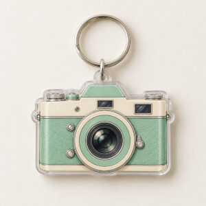 Vintage Camera Two-Layer Acrylic Keychain with camera body with a lens ring in mint and cream on the top layer and a plain slightly offset shadow layer behind it, 2-side printed